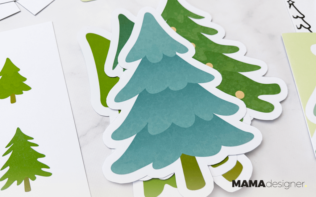 Zbliżenie na wycięte grafiki z ilustracjami choinek - 4 wzory do wyboru.