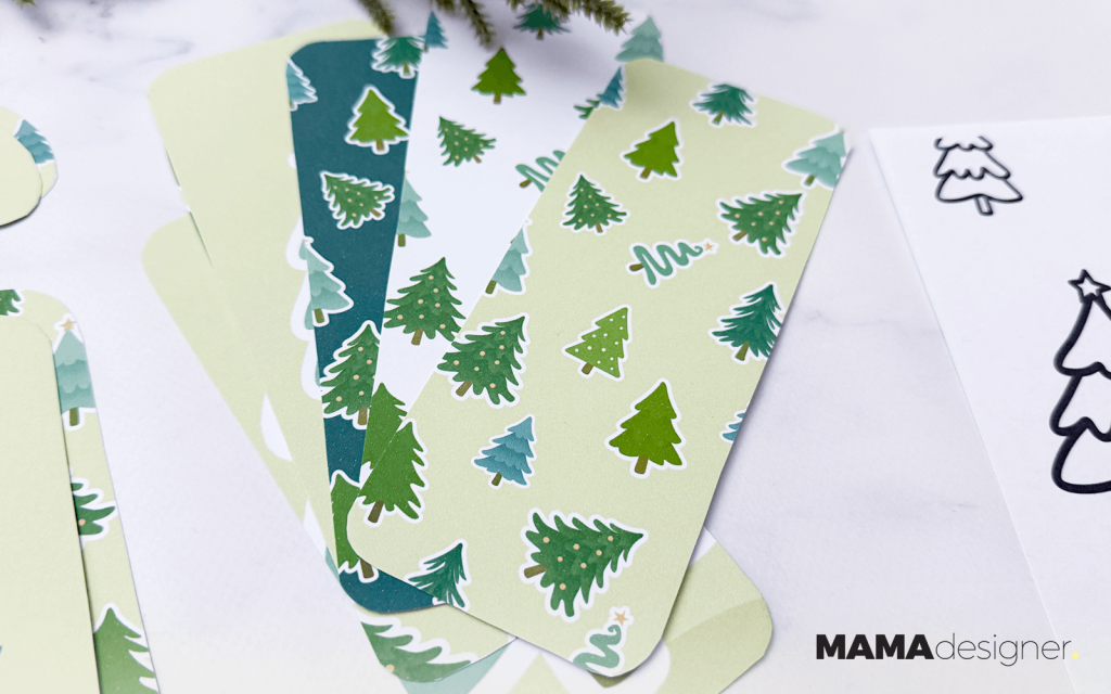 Zbliżenie na choinkowe zakładki do książek w 6 różnych wzorach.