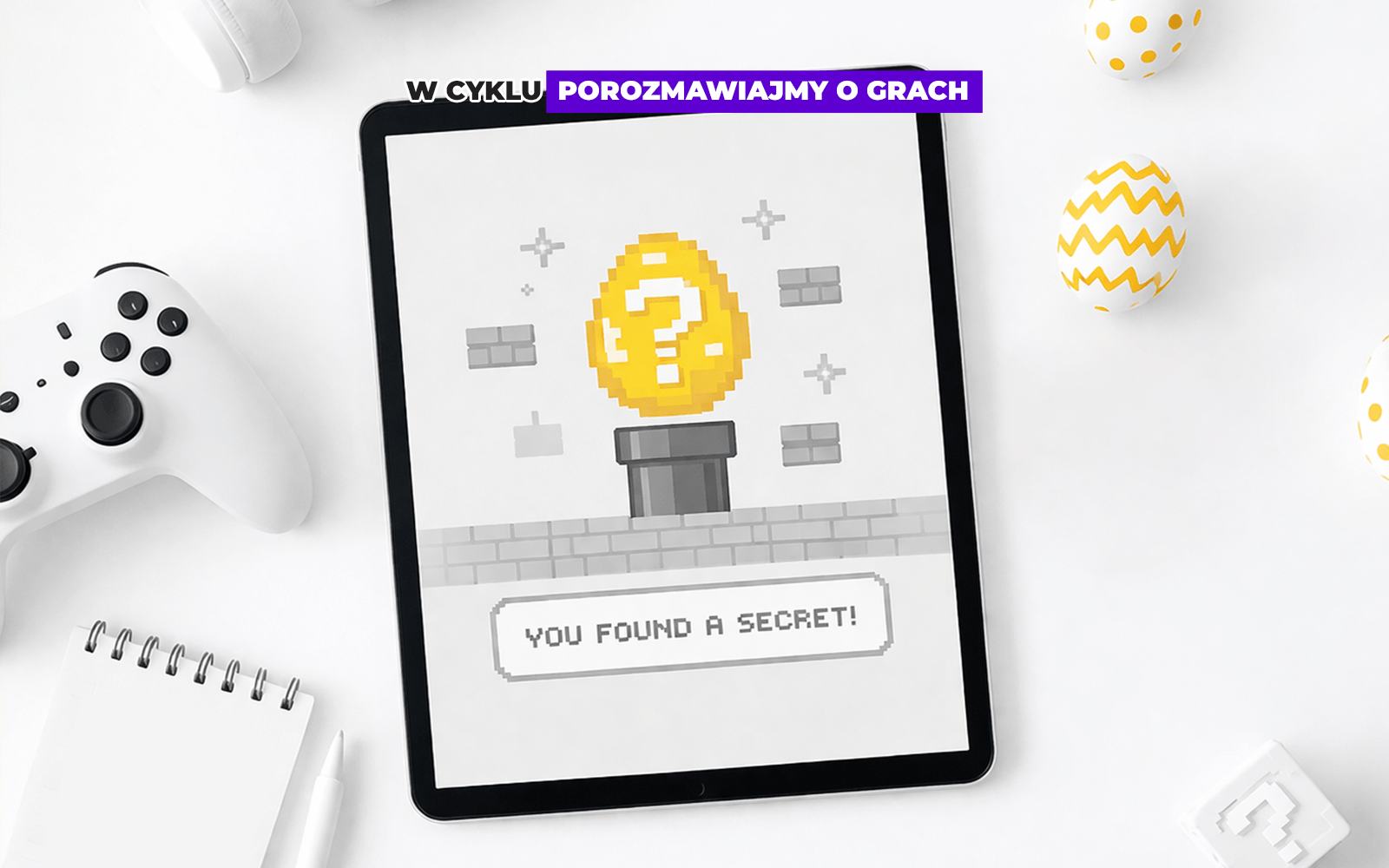 Tablet z wyświetlonym fragmentem gry ze złotym jajkiem.