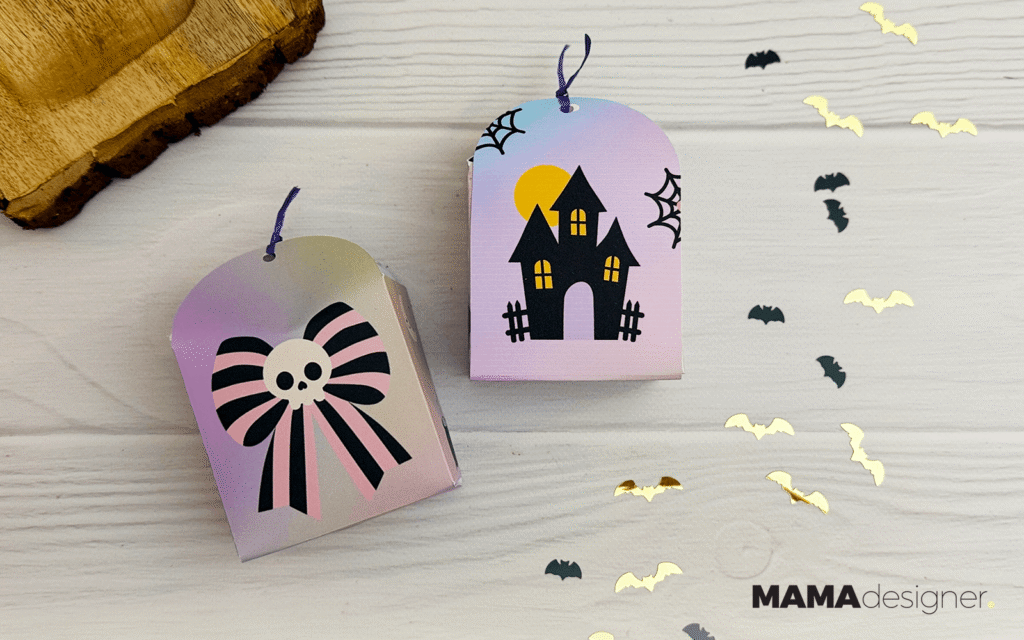 Dwa papierowe pudełka halloweenowe do druku z kokardą i nawiedzonym zamkiem